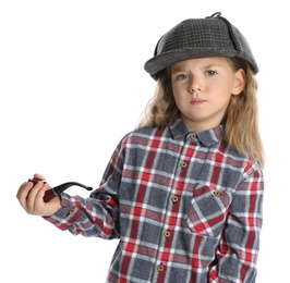 Photo of Cute little child in hat with smoking pipe playing detective on white background