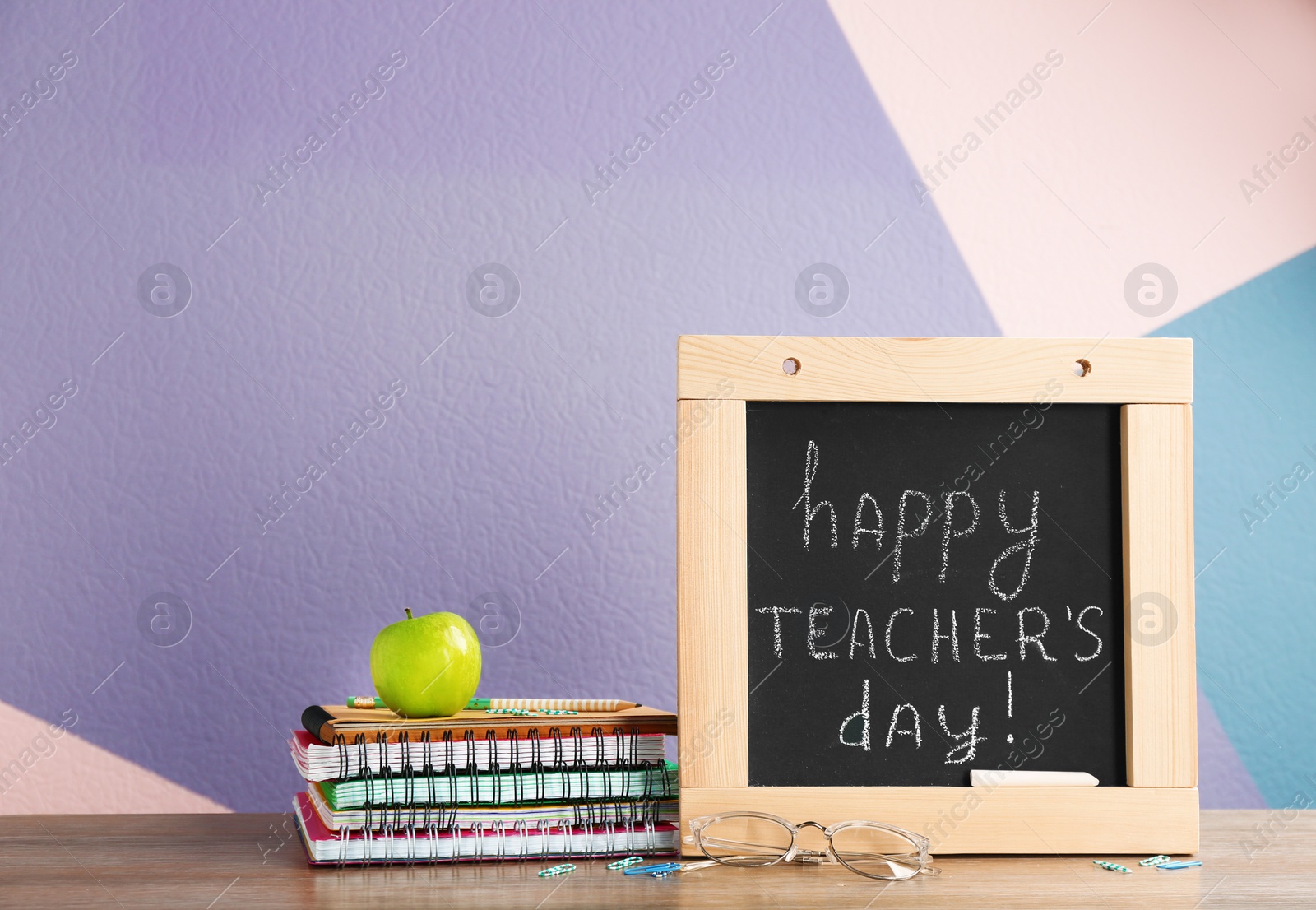 Photo of Composition with small chalkboard for Teacher's day on table