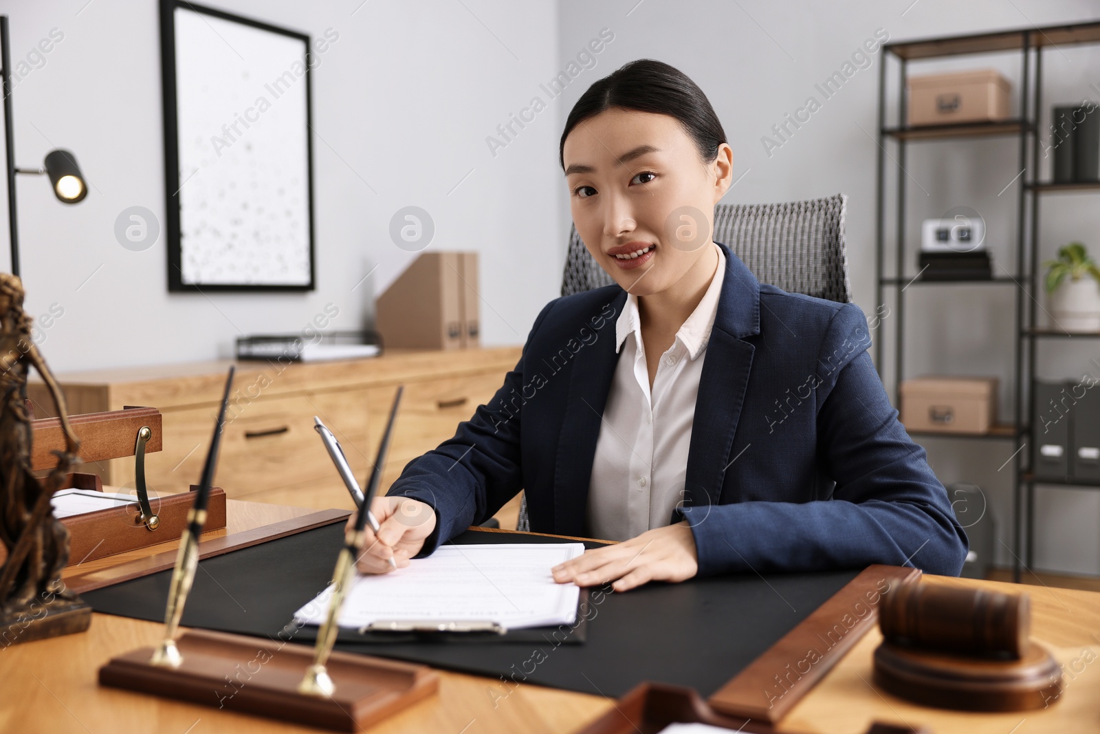 Photo of Portrait of notary at table in office