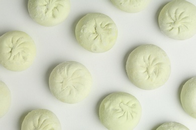 Composition with raw dumplings on white background, top view