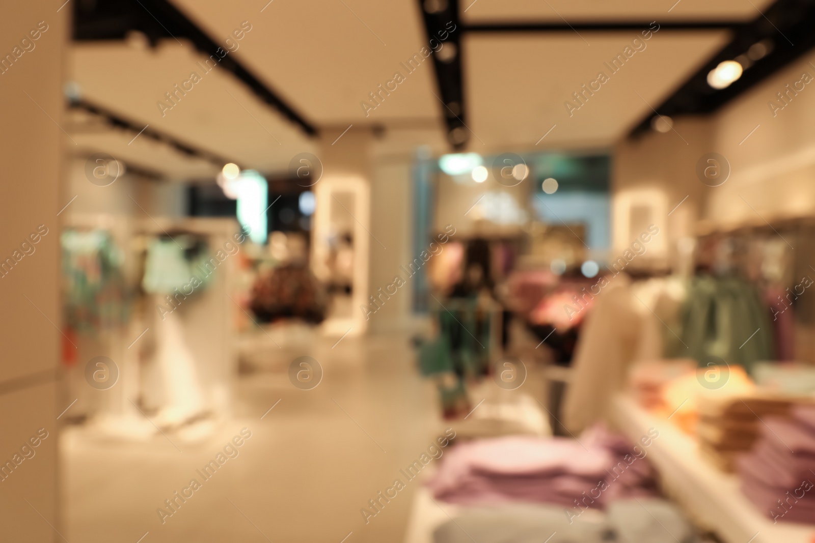 Photo of Blurred view of store interior in shopping mall. Bokeh effect