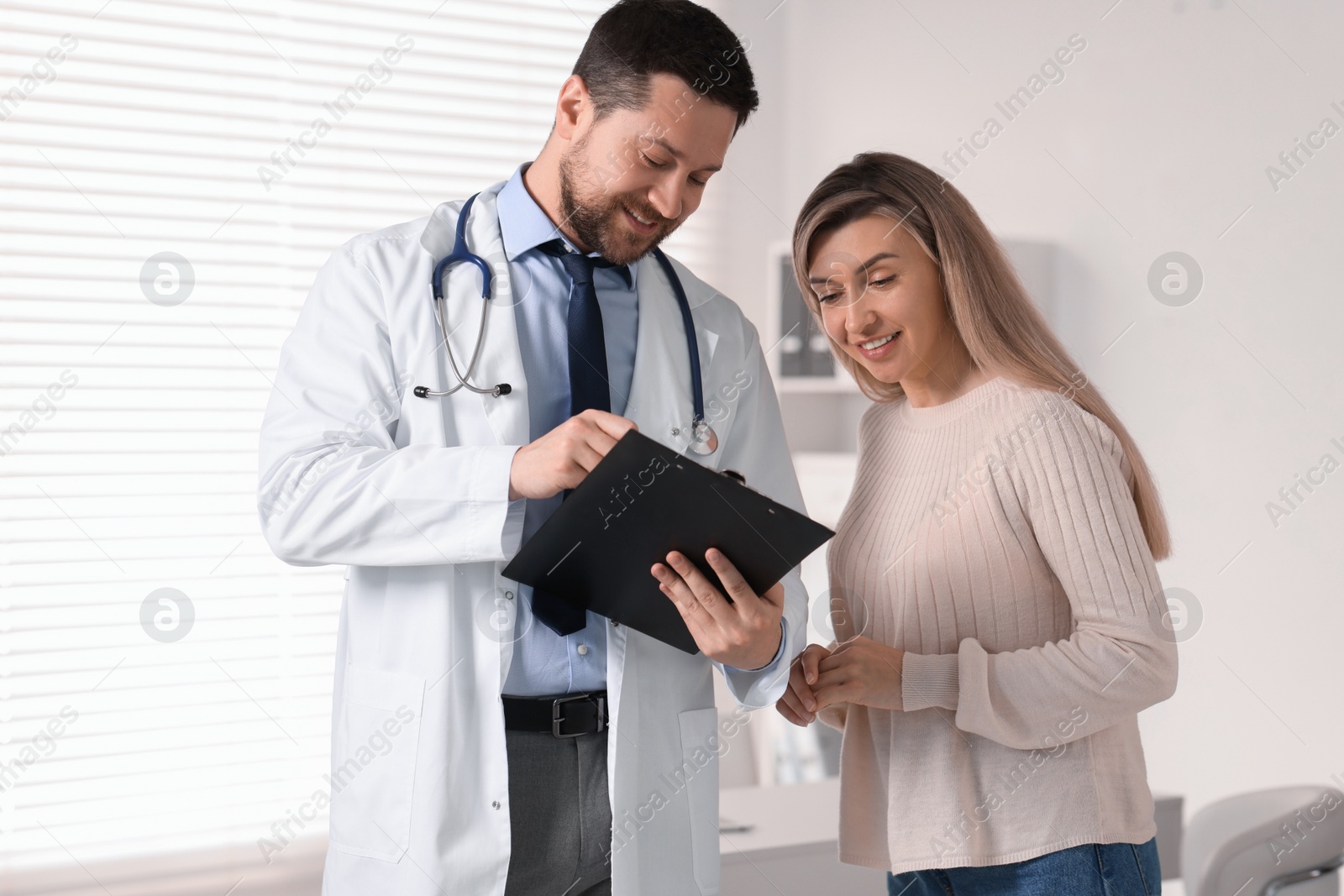 Photo of Professional doctor working with patient in hospital