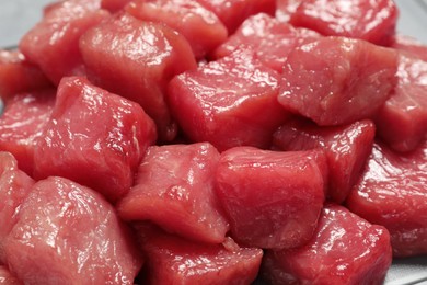 Photo of Cooking delicious goulash. Raw beef meat on table, closeup