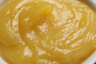 Photo of Delicious lemon curd in bowl, closeup view