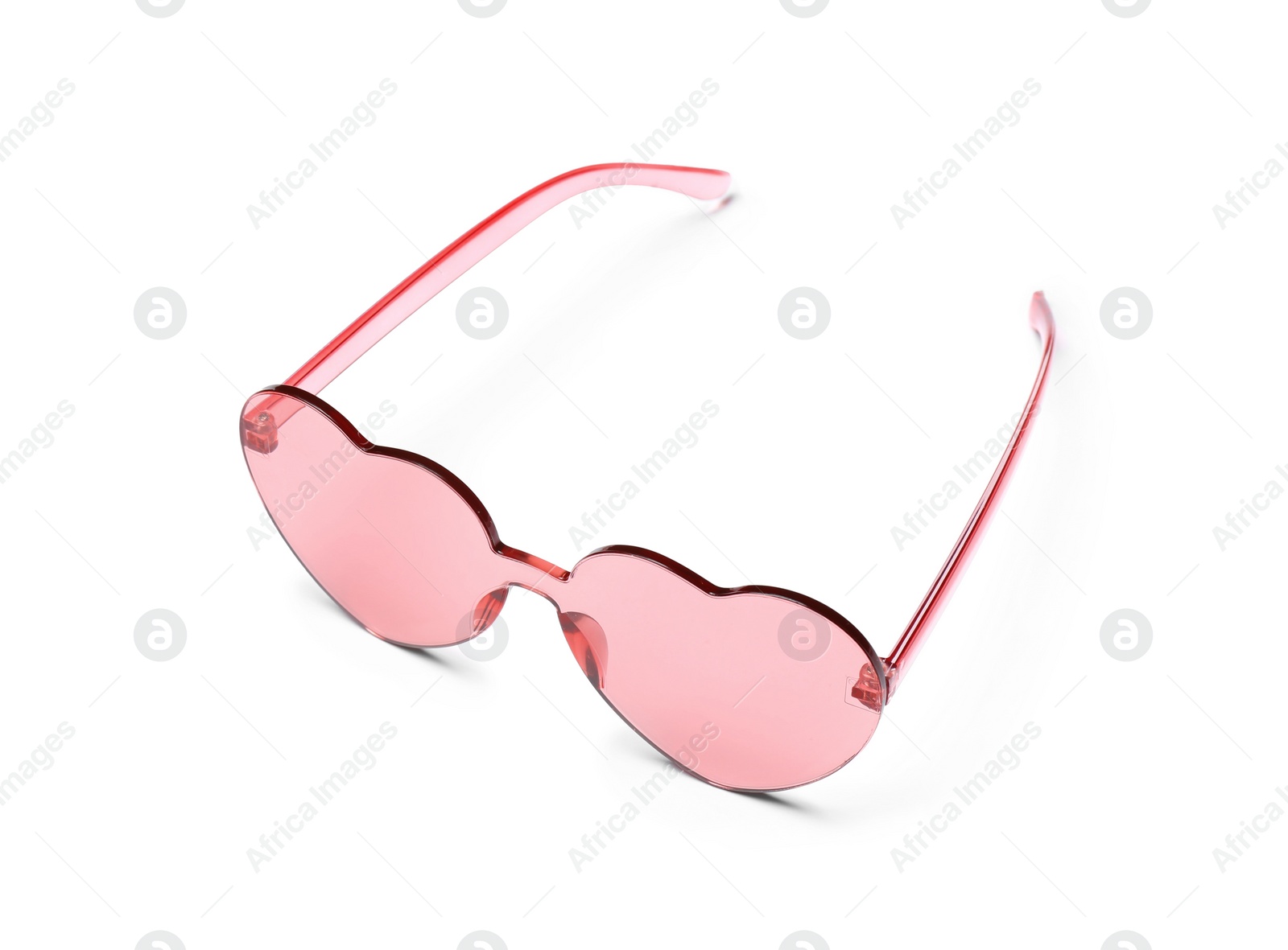 Photo of Stylish heart shaped glasses on white background