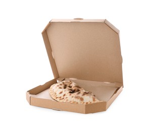 Photo of Cardboard box with delicious calzone on white background