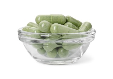 Vitamin capsules in bowl isolated on white. Health supplement