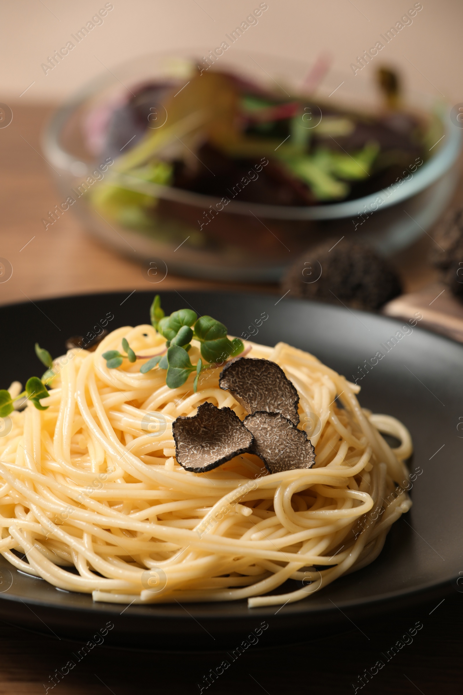 Photo of Tasty spaghetti with truffle on table, closeup