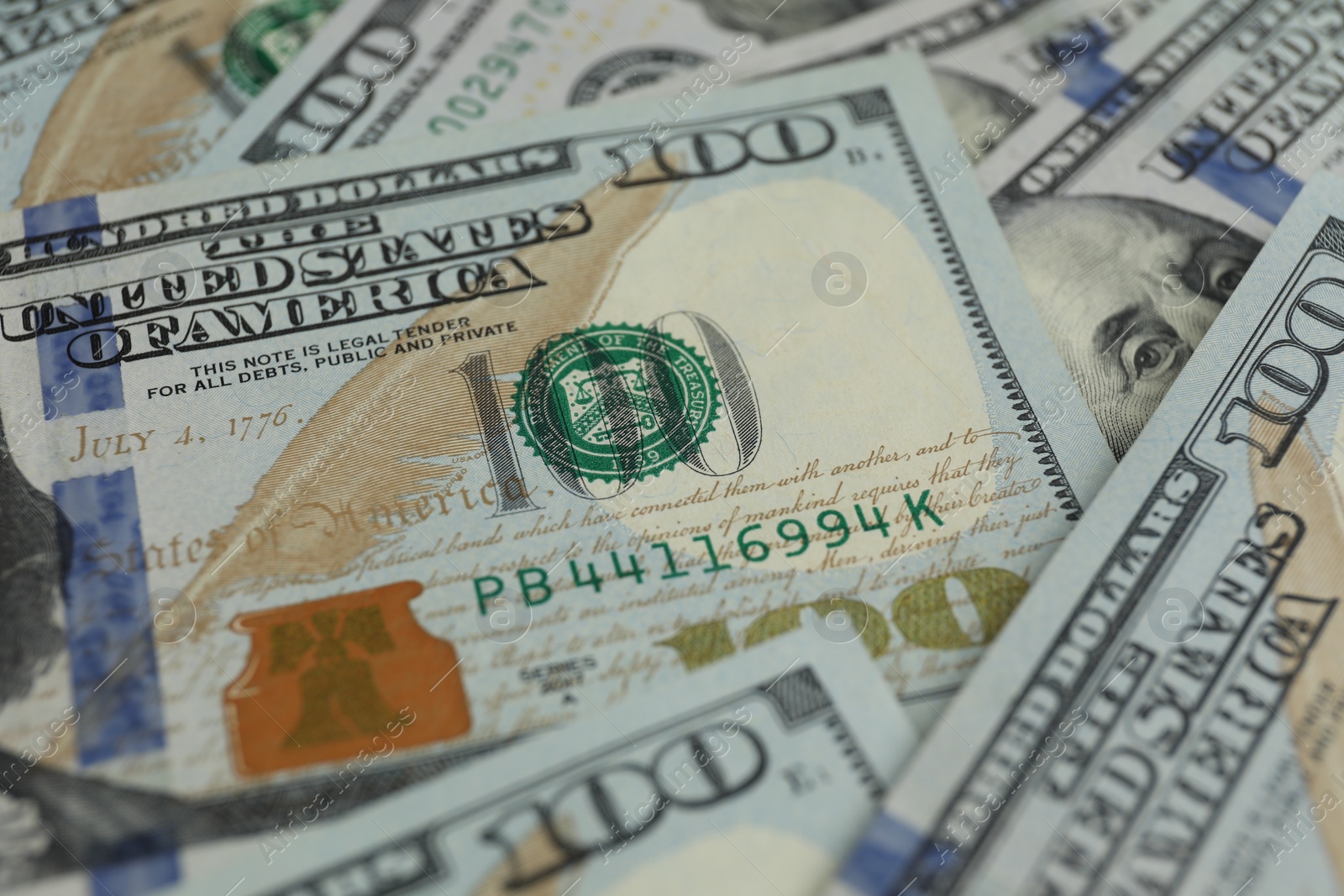 Photo of Money exchange. Dollar banknotes as background, closeup