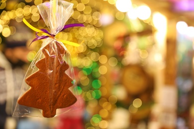 Cookie on blurred background, space for text. Christmas fair treat