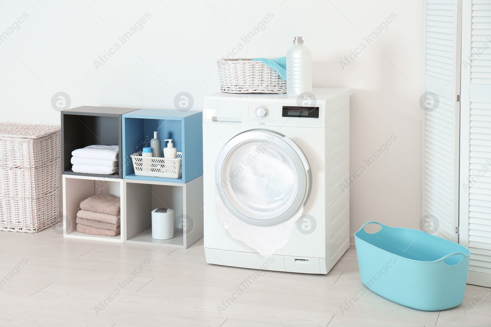 Image of Foam coming out from broken washing machine during laundering in room