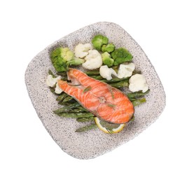 Photo of Plate of tasty grilled salmon, lemon and vegetables isolated on white, top view