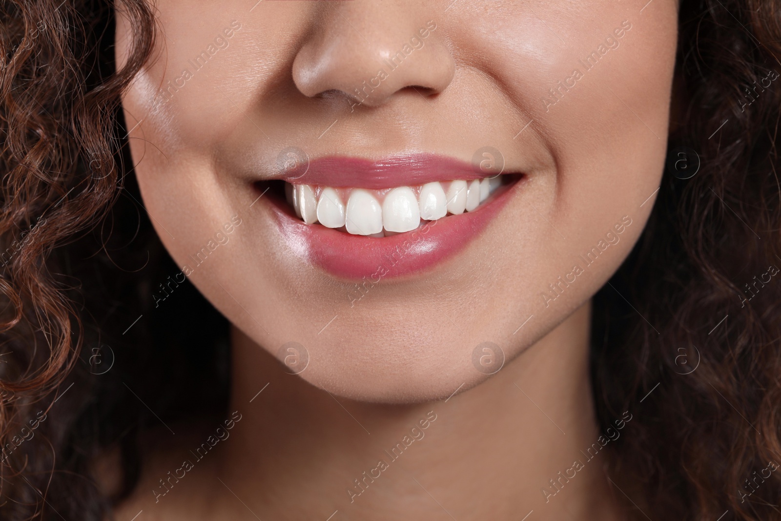 Photo of Young woman with beautiful smile, closeup view