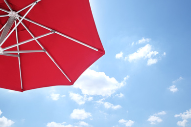 View of red umbrella and blue sky on sunny day