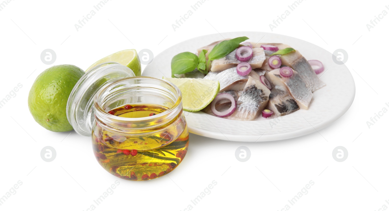 Photo of Tasty fish marinade in jar, herring and lime isolated on white