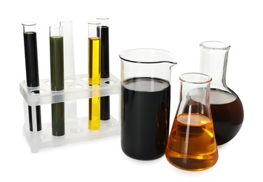 Beaker, test tubes and flasks with different types of oil isolated on white