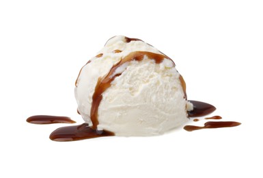 Photo of Scoop of ice cream with caramel sauce isolated on white