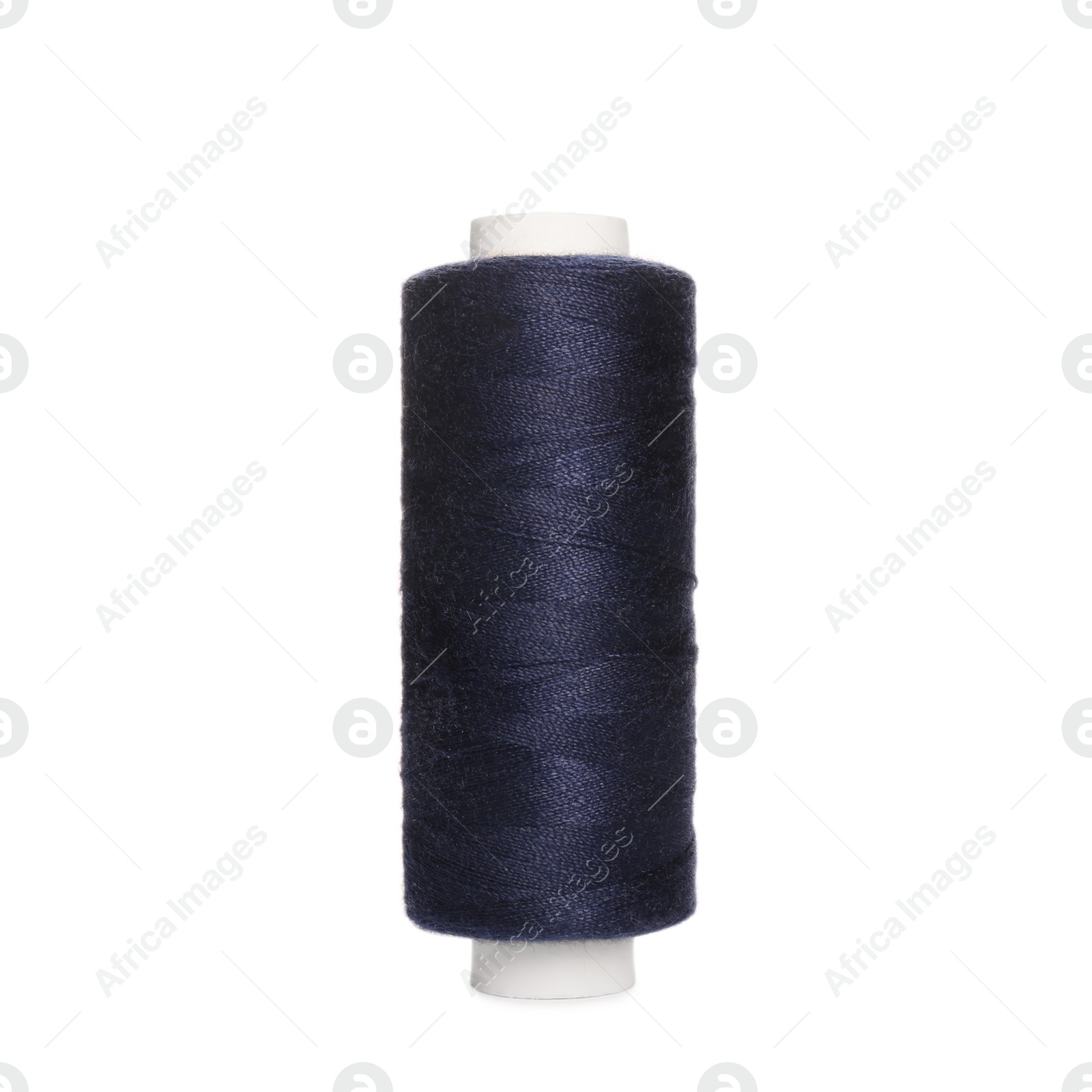 Photo of Spool of dark blue sewing thread isolated on white