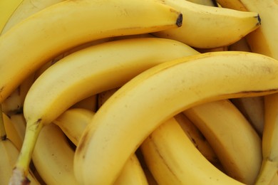 Photo of Many tasty bananas as background, closeup view