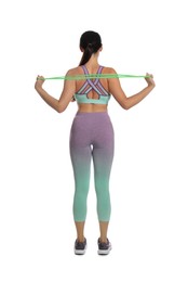 Photo of Woman doing sportive exercise with fitness elastic band on white background, back view