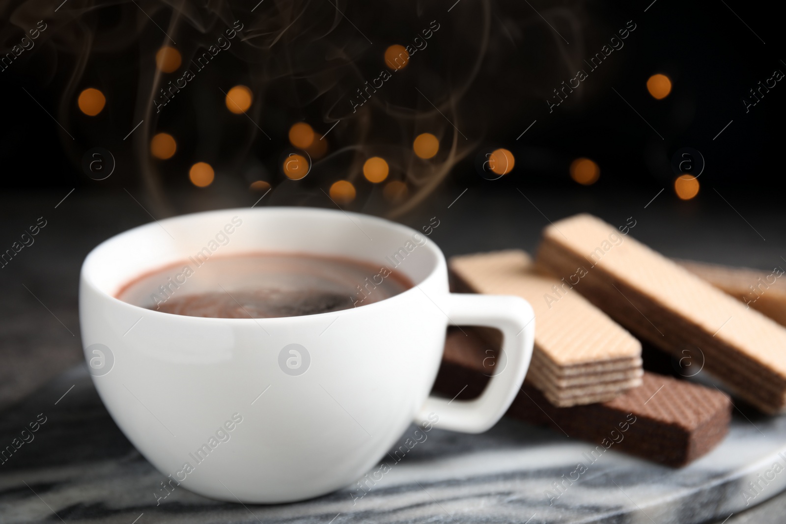 Photo of Delicious coffee and wafers marble board, closeup