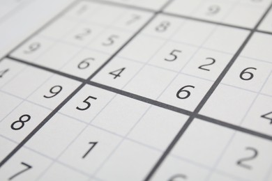 Photo of Sudoku puzzle grid as background, closeup view