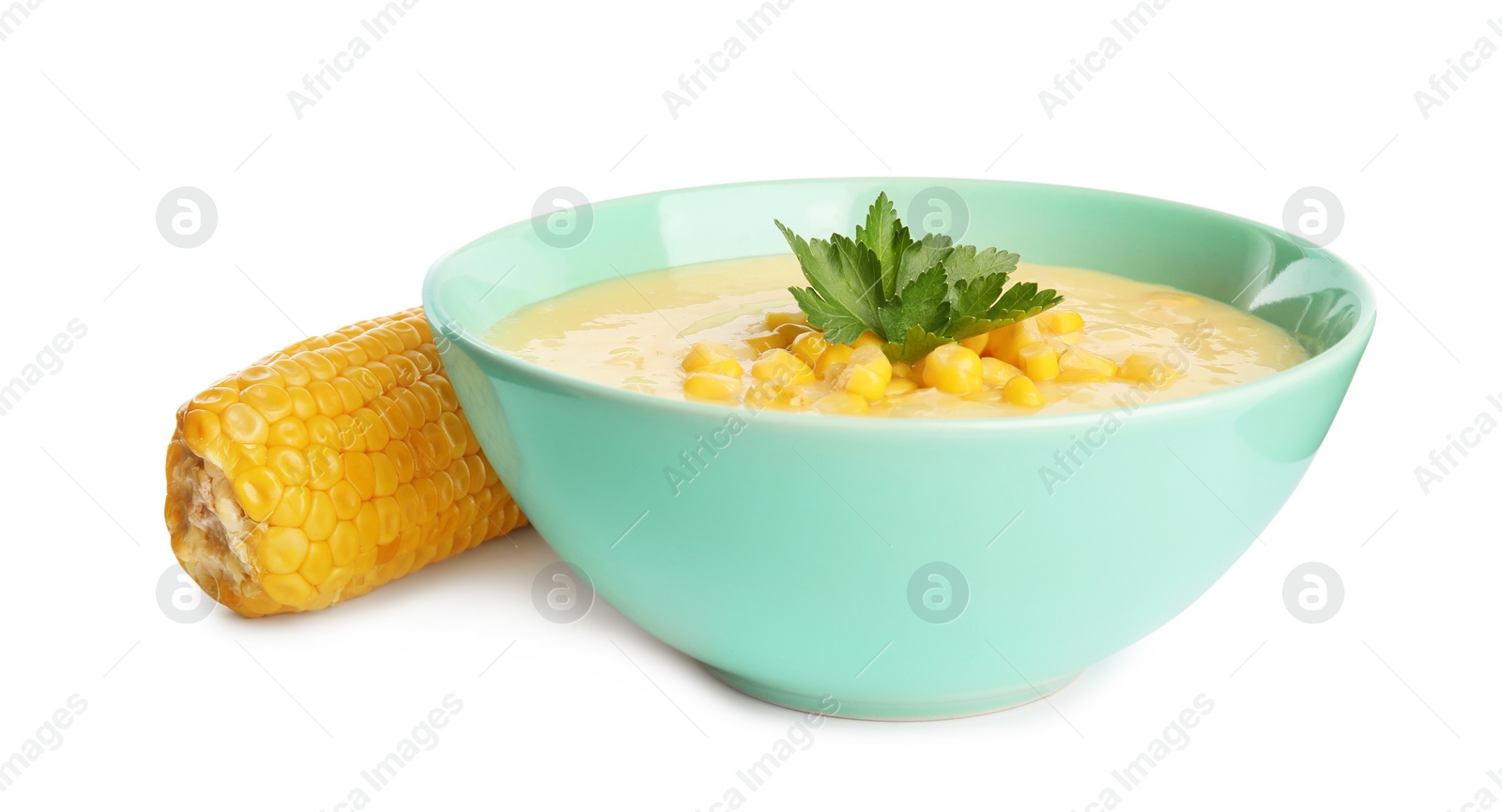 Photo of Delicious corn cream soup and cob on white background