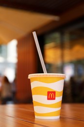 MYKOLAIV, UKRAINE - AUGUST 11, 2021: Cold McDonald's drink on table in cafe