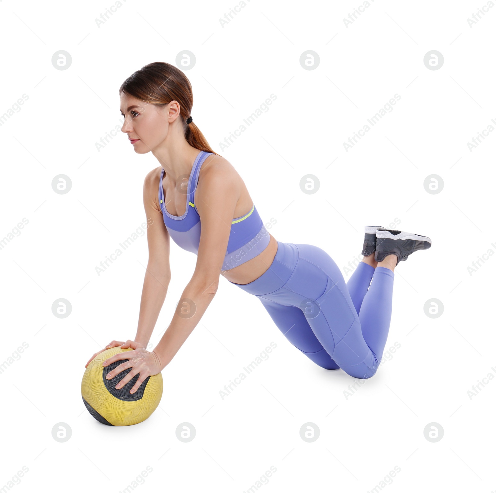 Photo of Athletic woman doing exercise with medicine ball isolated on white