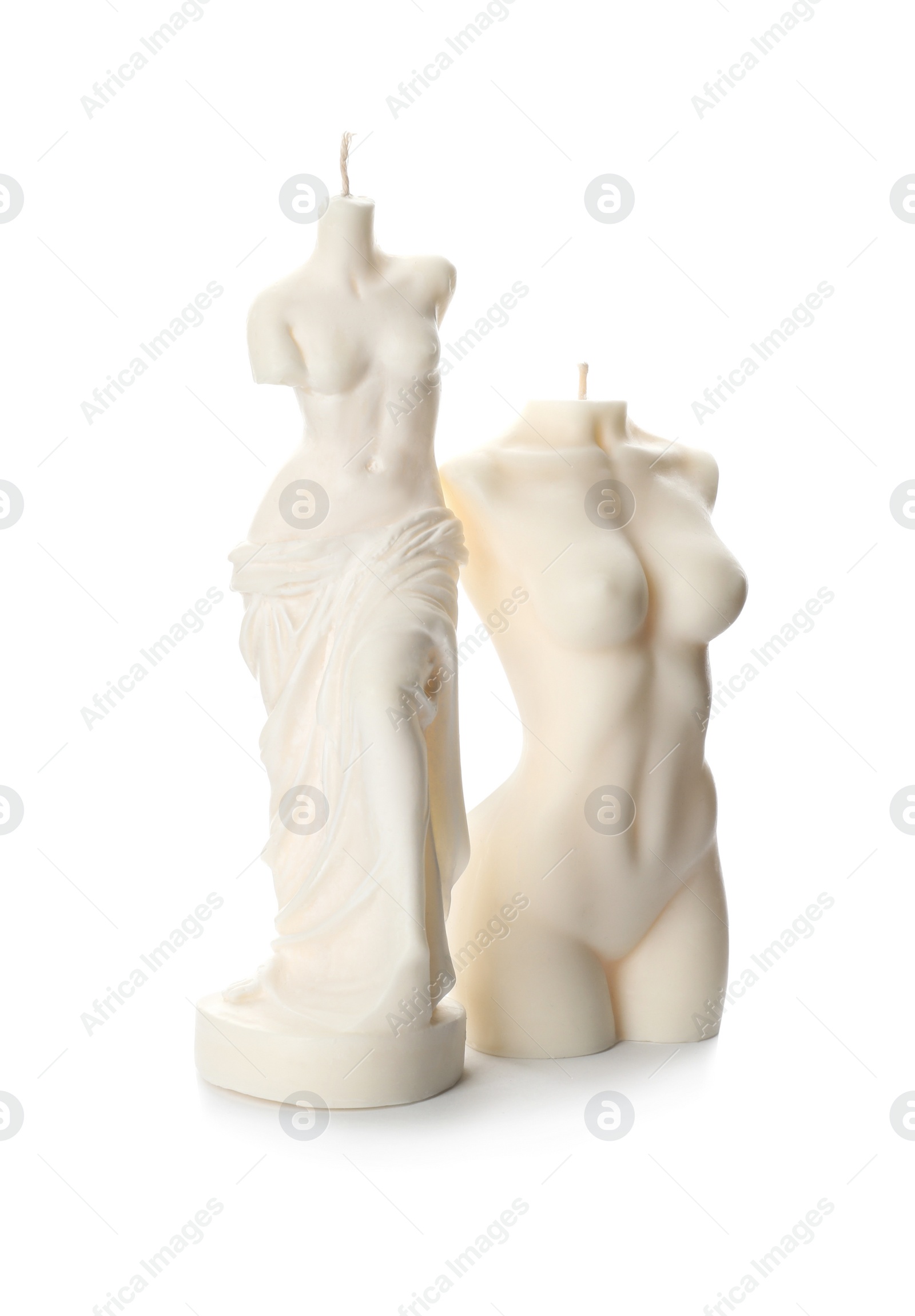 Photo of Beautiful female body shaped candles on white background