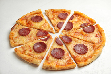 Tasty pepperoni pizza on white table, closeup