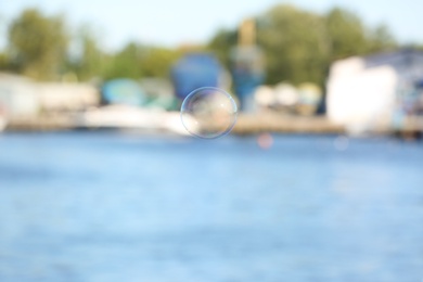 Beautiful translucent soap bubble outdoors on sunny day