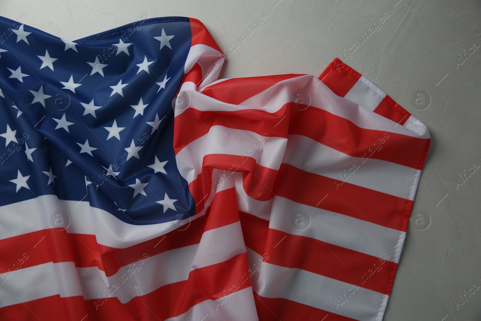 Photo of Flag of USA on white table, top view