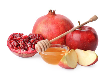 Photo of Honey, apples and pomegranate on white background. Rosh Hashanah holiday