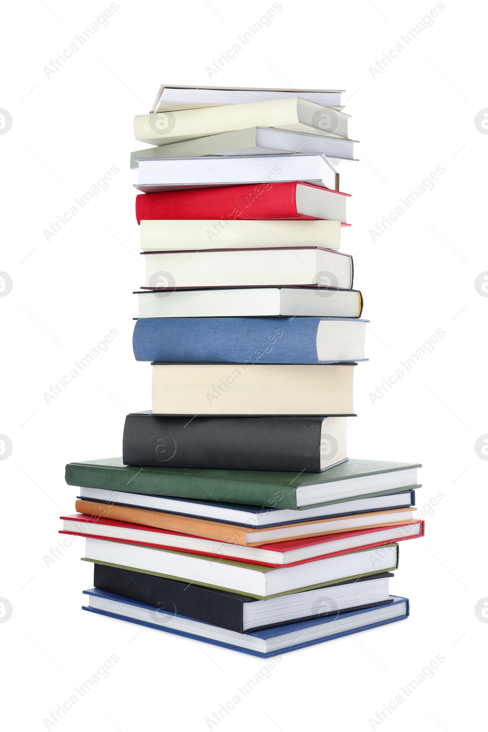 Photo of Many different books stacked on white background