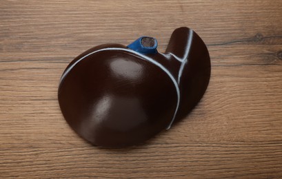 Model of liver on wooden table, top view