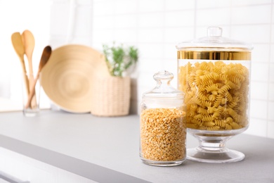 Products in modern kitchen glass containers on table. Space for text