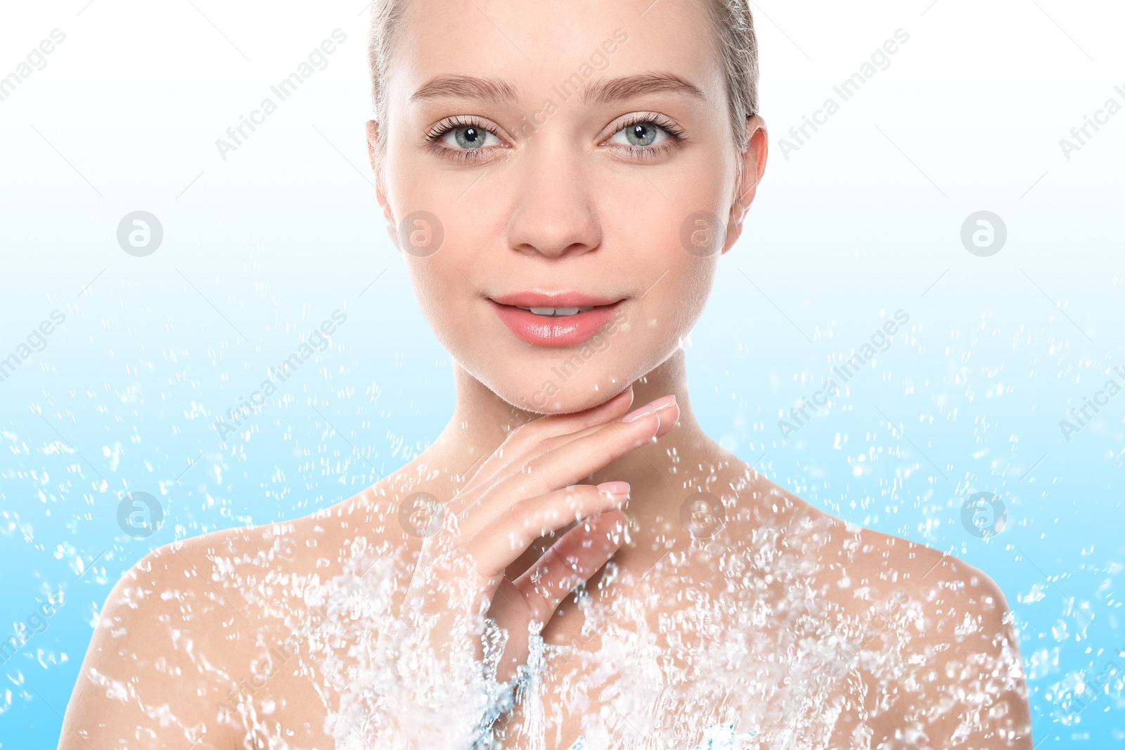 Image of Portrait of beautiful young woman with perfect moisturized skin and splashing water