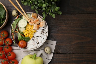 Photo of Delicious poke bowl and ingredients on wooden table, flat lay. Space for text