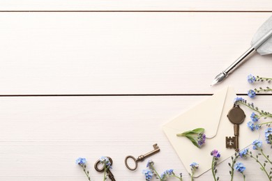 Photo of Flat lay composition with beautiful Forget-me-not flowers on white wooden table. Space for text