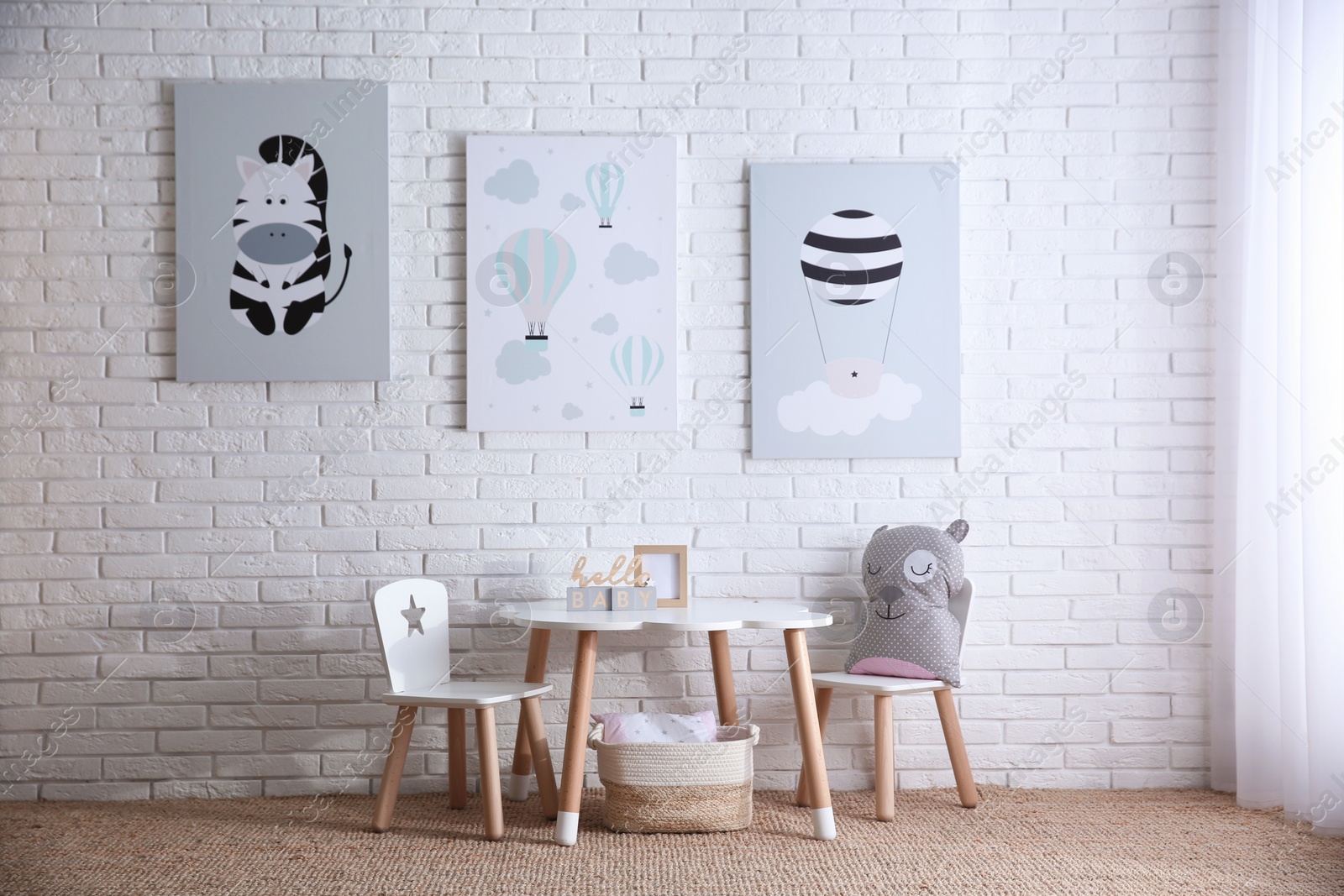 Photo of Baby room interior with toys and stylish furniture