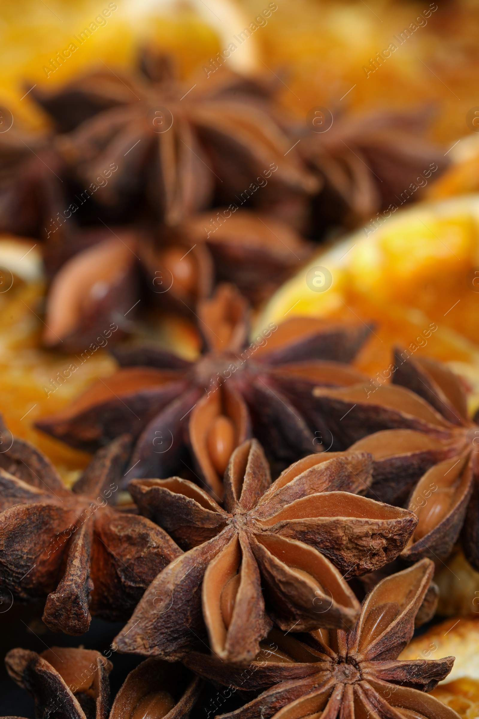 Photo of Dry orange slices and anise stars as background, closeup