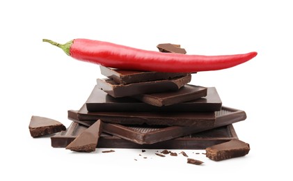 Red hot chili pepper and pieces of dark chocolate isolated on white