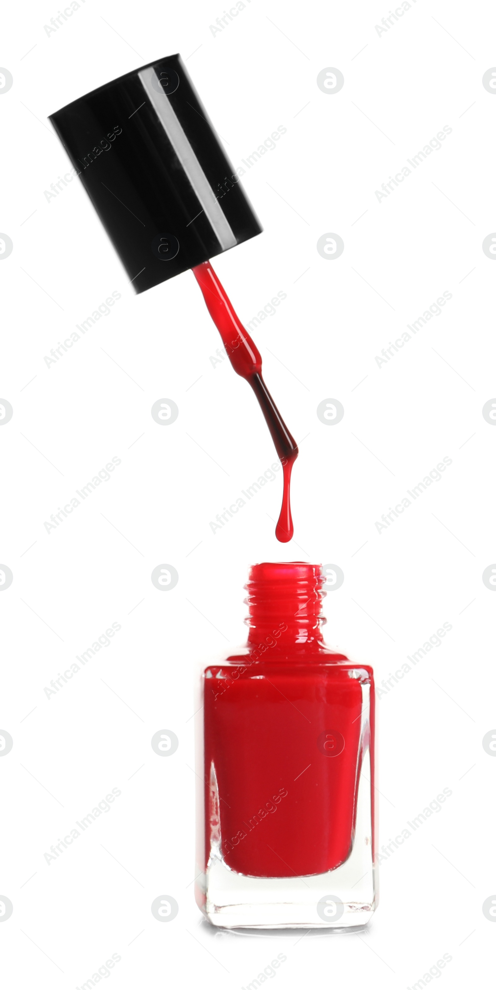 Photo of Brush over nail polish bottle on white background