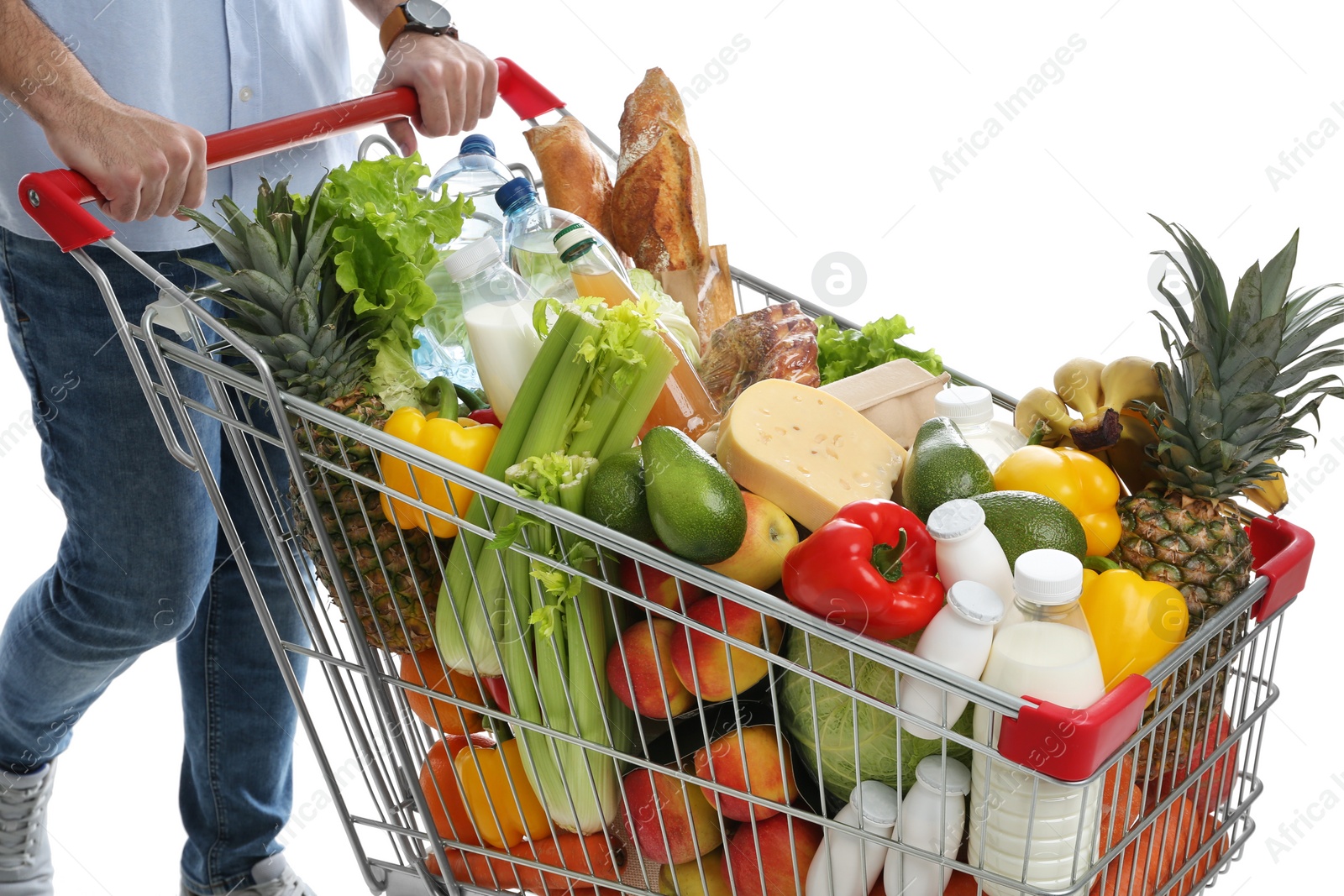 Photo of Man with shopping cart full of groceries on white background, closeup