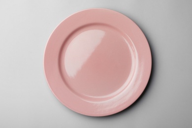 Photo of Clean empty plate on grey background, top view