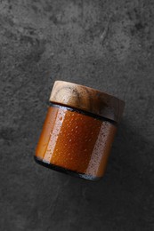 Jar of cosmetic product on grey background, top view