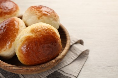 Freshly baked soda water scones on white wooden table, closeup