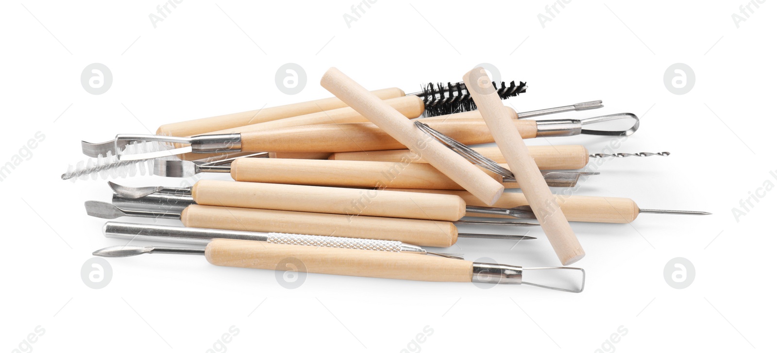 Photo of Set of different clay crafting tools isolated on white