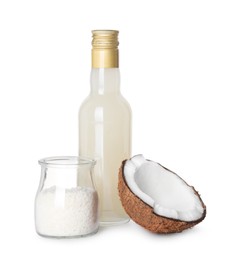 Photo of Bottle of delicious syrup for coffee, coconut and flakes isolated on white